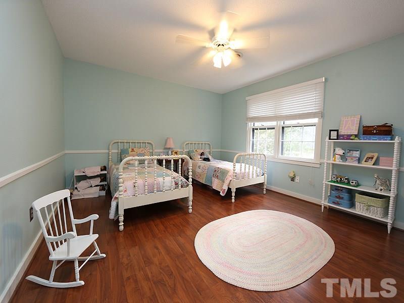 This bedroom also has laminate easy care wood looking floors and a walk in closet.