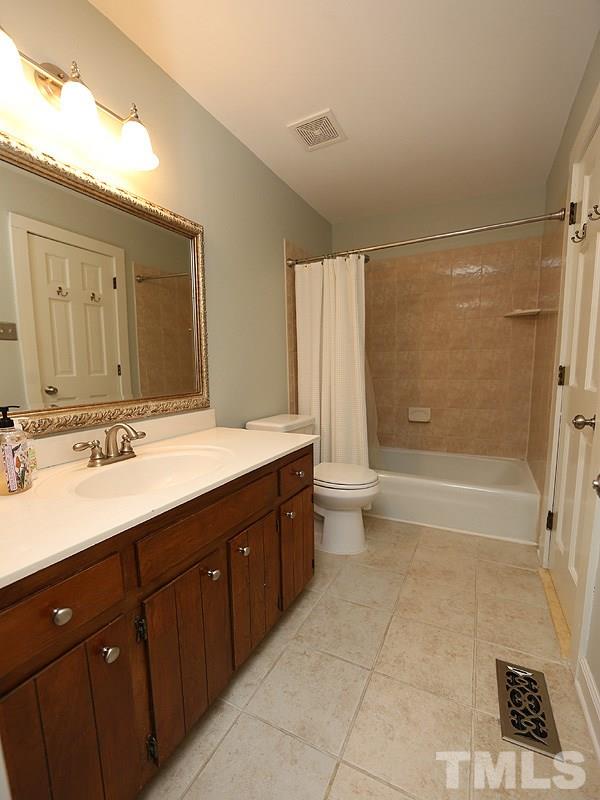 1608 Barley Place Raleigh, NC 27615 - Photo 9 of 17 This bathroom has tile floors and easy access to master bedroom and hallway.