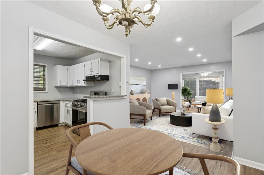 1308 Natchez Trace Atlanta, GA 30350 - Photo 12 of 27 a living room with stainless steel appliances kitchen island granite countertop furniture and a kitchen view