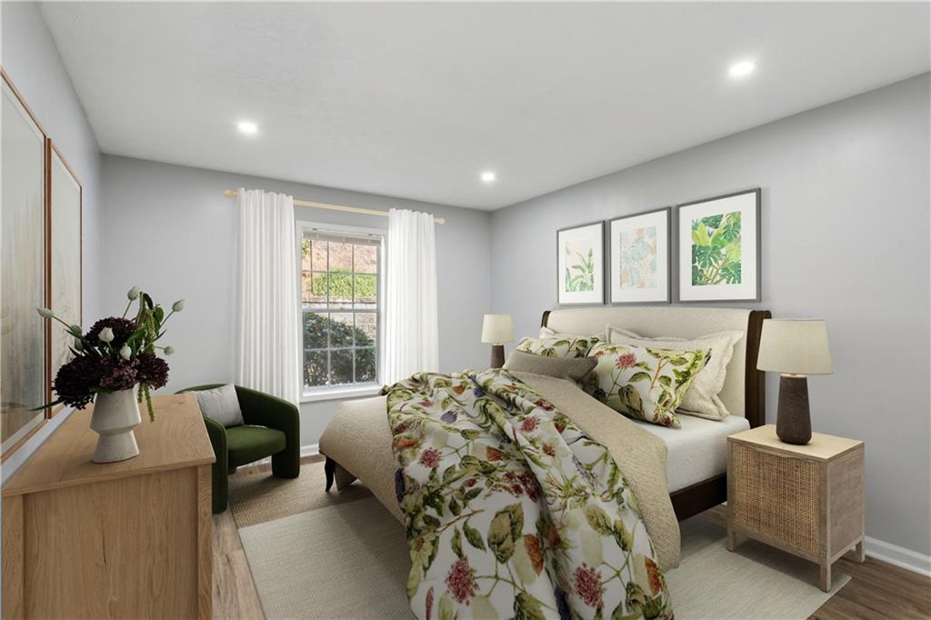 1308 Natchez Trace Atlanta, GA 30350 - Photo 16 of 27 a bedroom with a bed and a couch