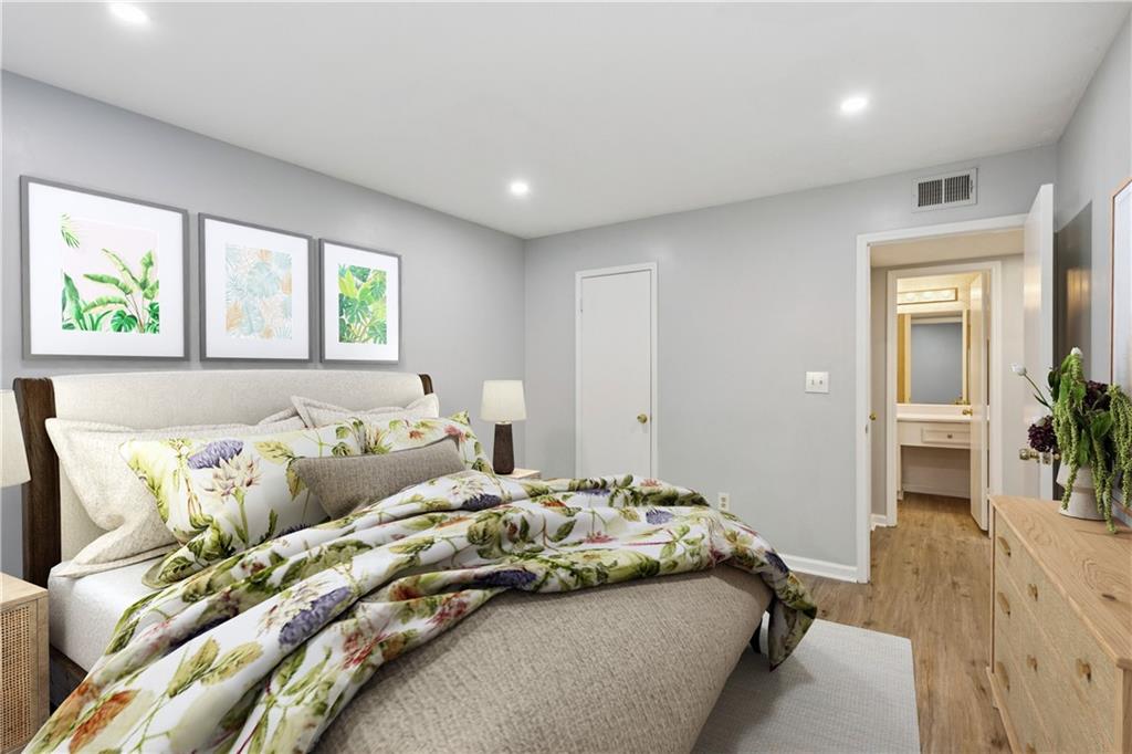 1308 Natchez Trace Atlanta, GA 30350 - Photo 17 of 27 a bedroom with a bed and a couch