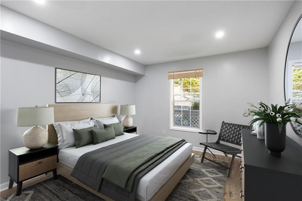 1308 Natchez Trace Atlanta, GA 30350 - Photo 19 of 27 a bedroom with bed and a window