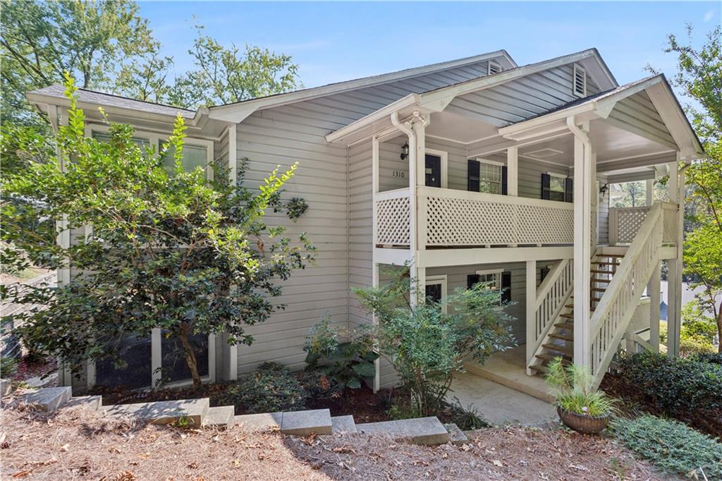1308 Natchez Trace Atlanta, GA 30350 - Photo 2 of 27 a front view of a house with plants