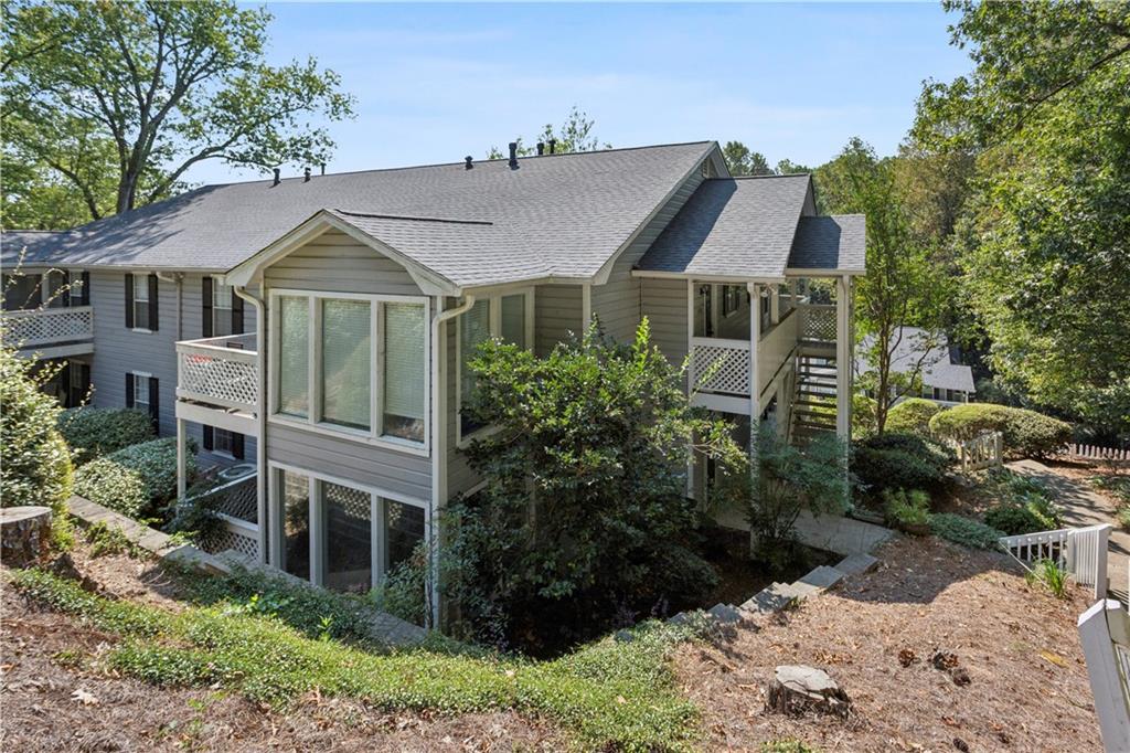1308 Natchez Trace Atlanta, GA 30350 - Photo 24 of 27 a front view of a house with a yard
