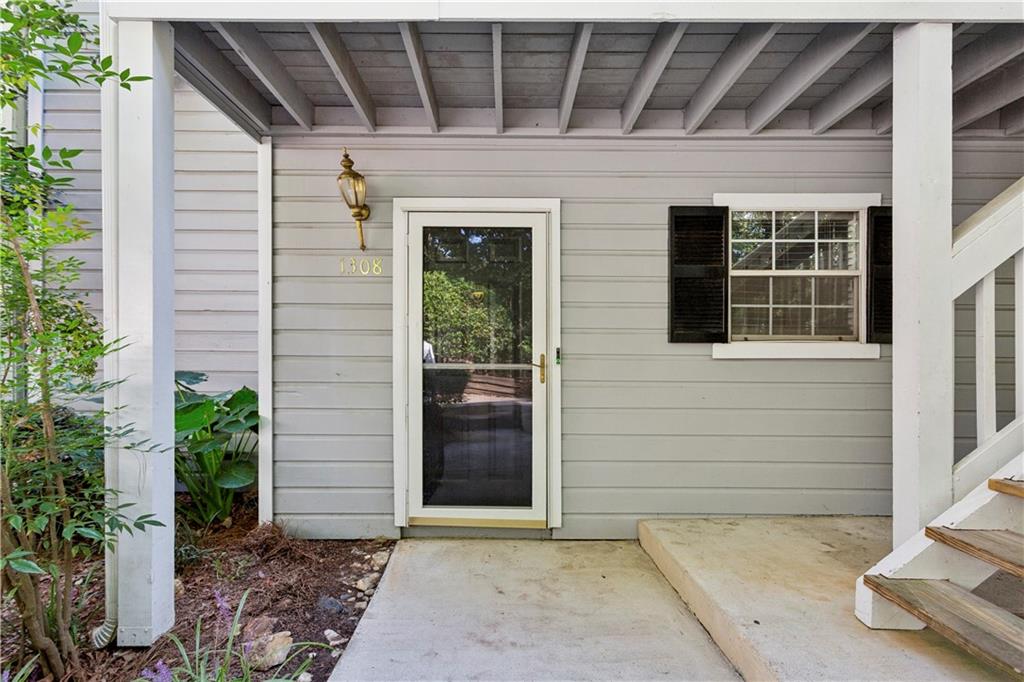 1308 Natchez Trace Atlanta, GA 30350 - Photo 3 of 27 a view of house with entryway door and potted plants