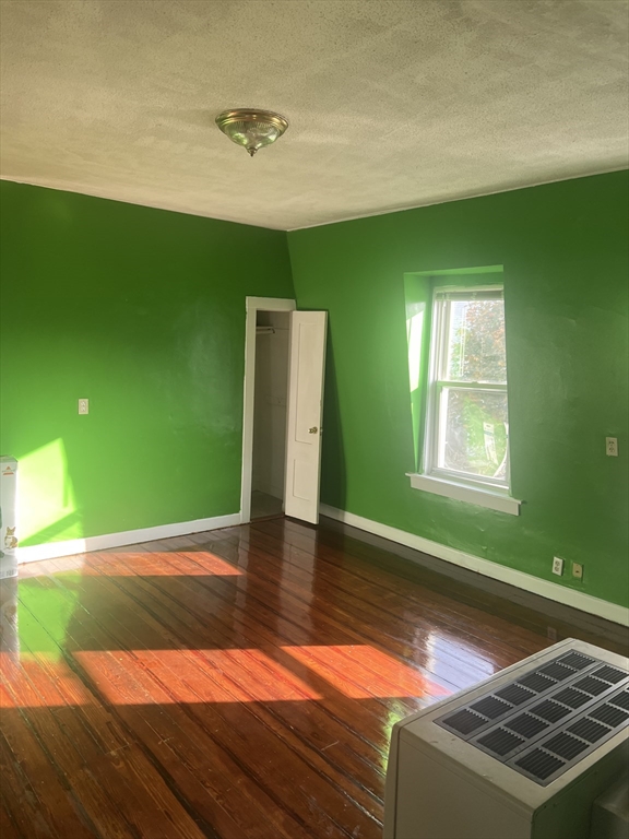 1241 North High Street, Unit 2 Fall River, MA 02720 - Photo 3 of 12 a view of a room with window wooden floor and windows