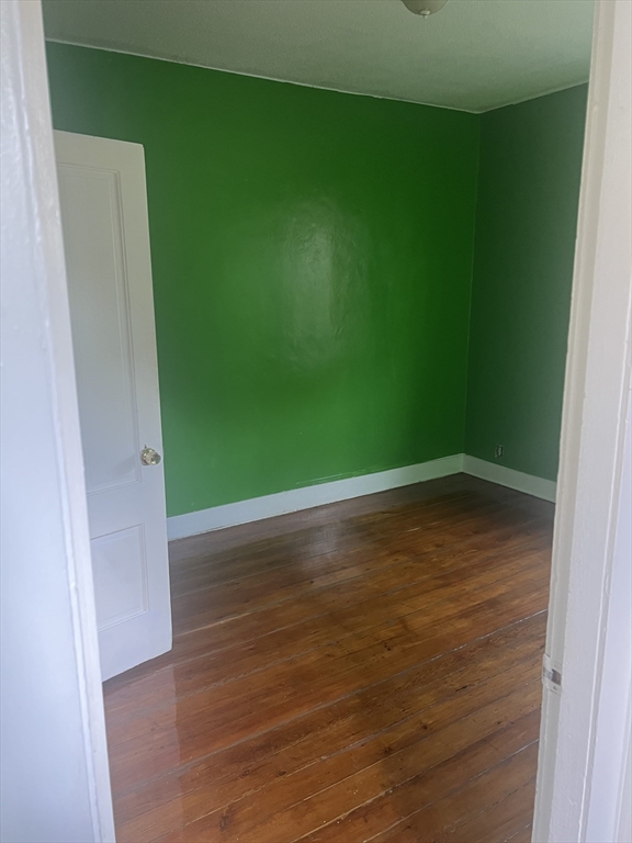 1241 North High Street, Unit 2 Fall River, MA 02720 - Photo 9 of 12 a view of a room with wooden floor