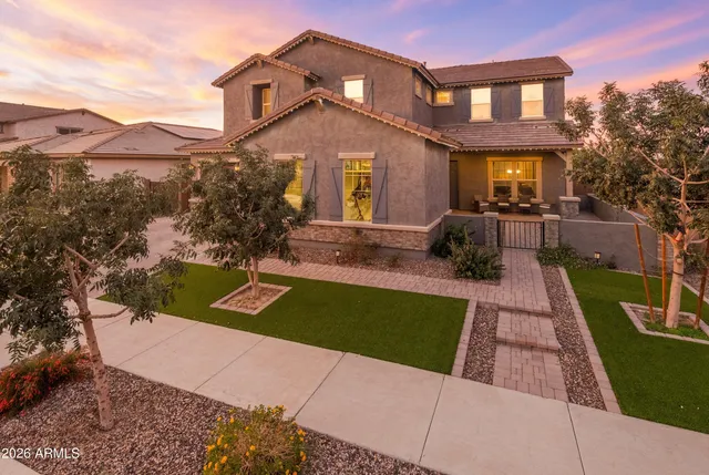 a front view of a house with a yard