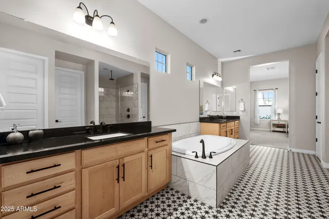 a bathroom with a glass shower door