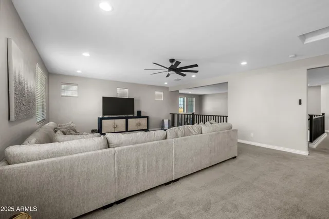 a spacious bedroom with a bed and a window