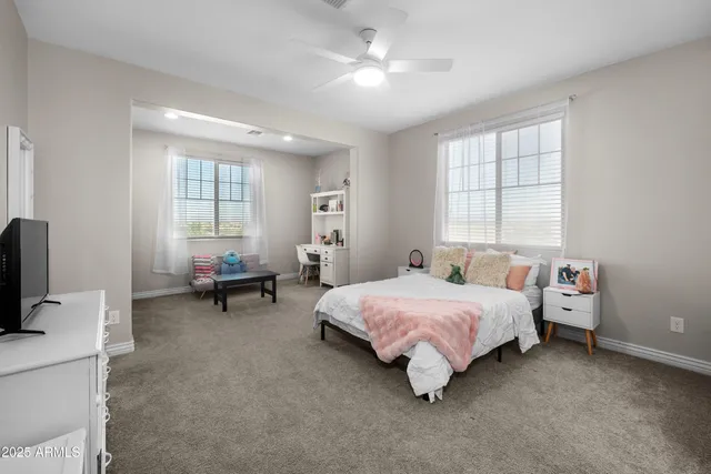 a en suite bathroom with a sink and a mirror