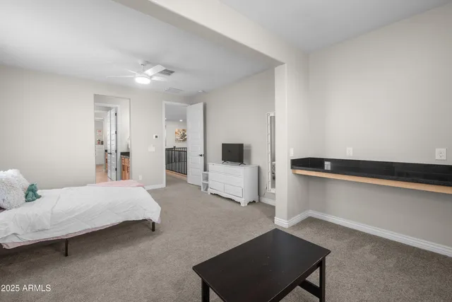 a white toilet sitting next to a bathroom sink and tub