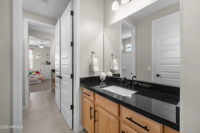 a bedroom with furniture and a flat screen tv