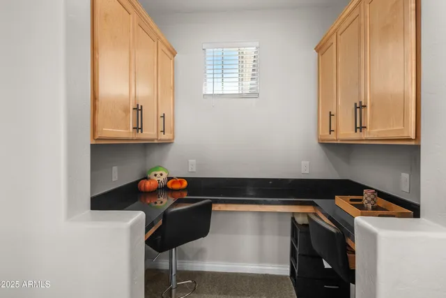 a bedroom with a bed and a flat tv screen