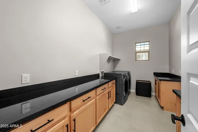 a front view of a house with garden and patio