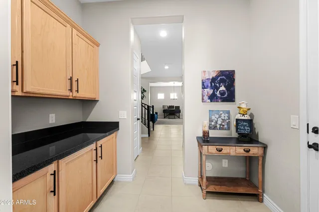 a view of an house with swimming pool and sitting area