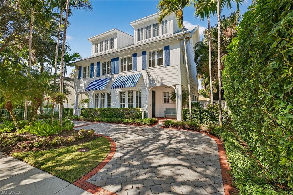 a view of a brick building next to a yard
