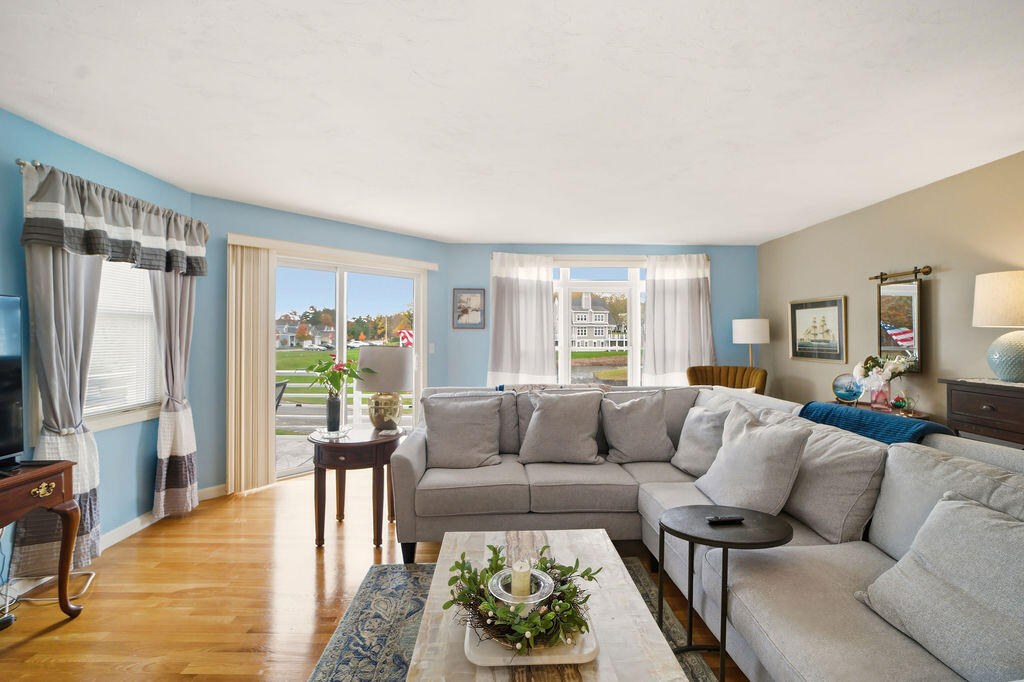 69 Bay Pointe Dr Extension, Unit 69 Buzzards Bay, MA 02532 - Photo 12 of 44 a living room with furniture and a large window