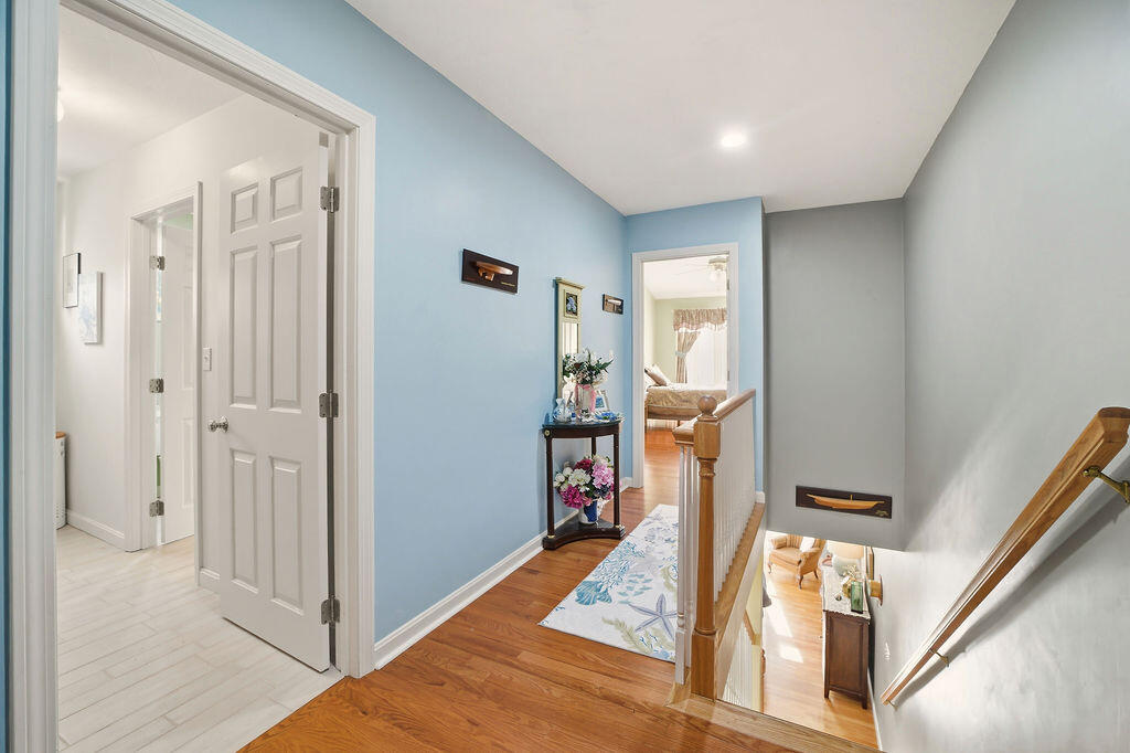 69 Bay Pointe Dr Extension, Unit 69 Buzzards Bay, MA 02532 - Photo 19 of 44 a view of a hallway with a livingroom and furniture
