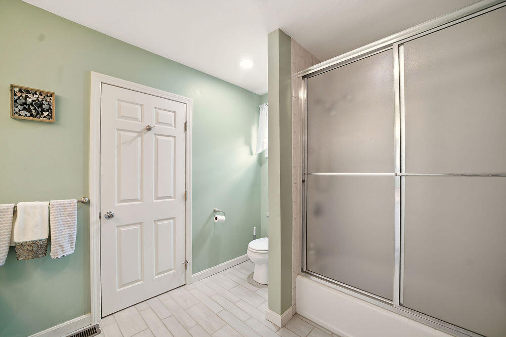 69 Bay Pointe Dr Extension, Unit 69 Buzzards Bay, MA 02532 - Photo 24 of 44 a bathroom with a shower and a toilet