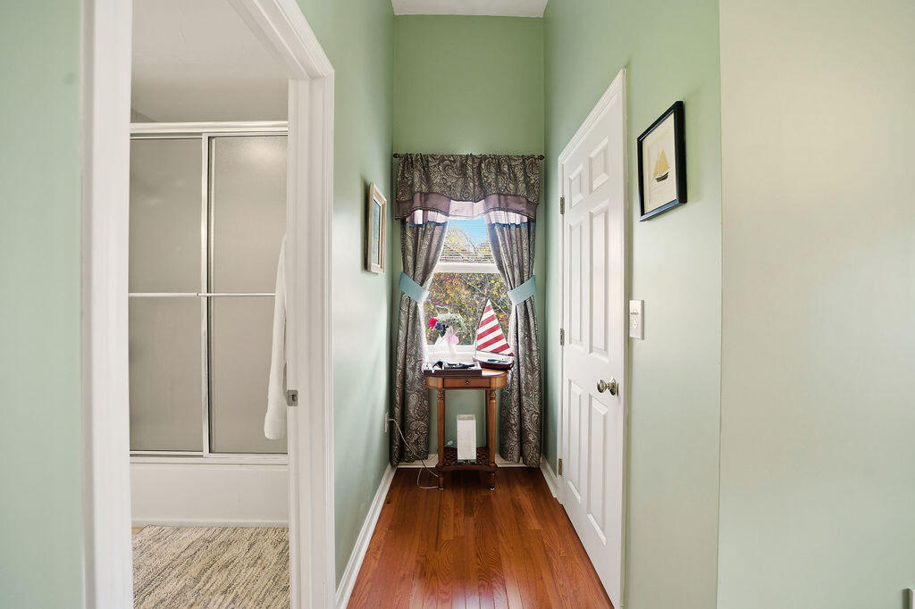 69 Bay Pointe Dr Extension, Unit 69 Buzzards Bay, MA 02532 - Photo 25 of 44 a view of a hallway view with wooden floor and staircase