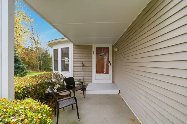 a view of a patio with table and chairs and potted plants