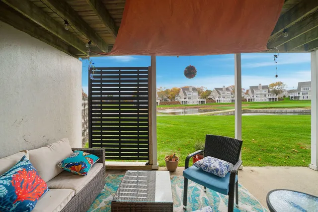 a view of a patio with a yard