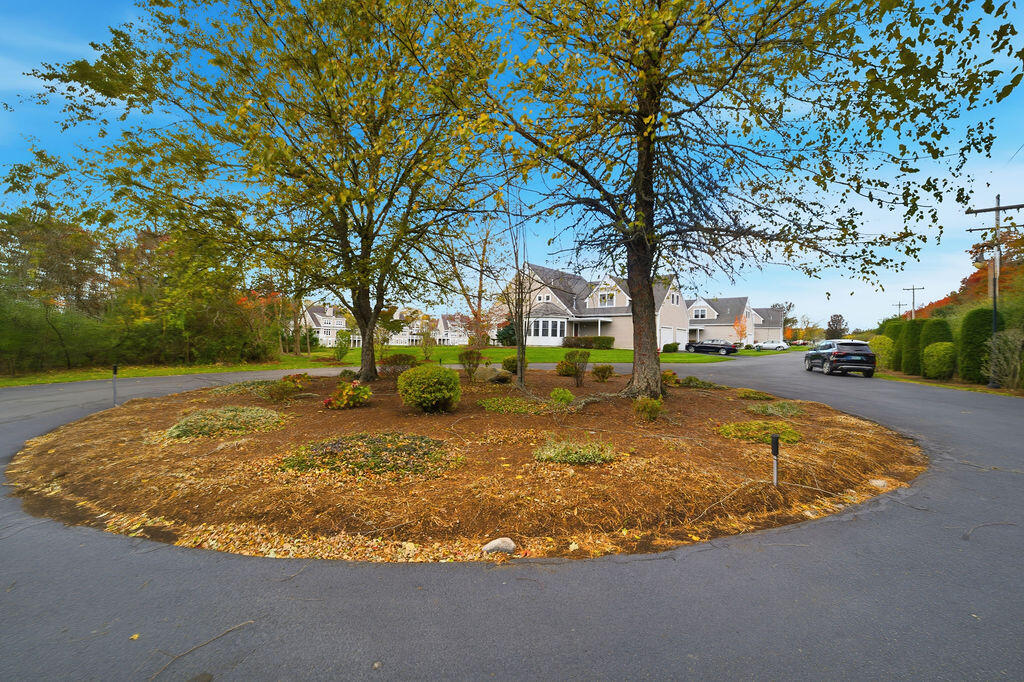 69 Bay Pointe Dr Extension, Unit 69 Buzzards Bay, MA 02532 - Photo 4 of 44 a view of a playground with basketball court