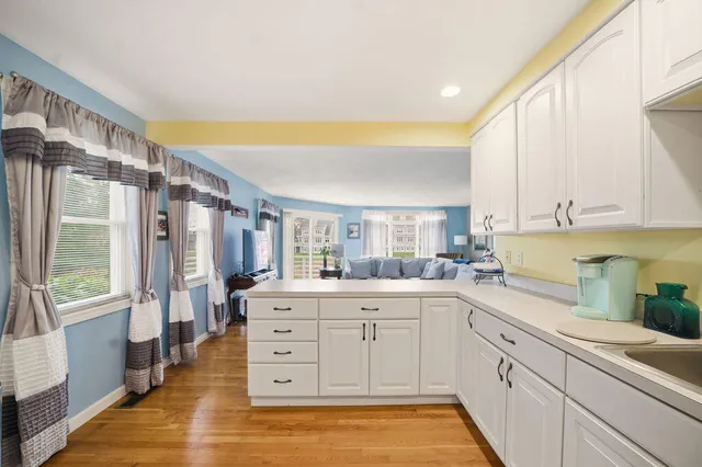 a kitchen with stainless steel appliances a sink and cabinets