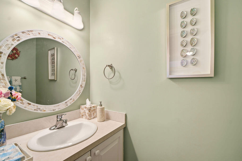 69 Bay Pointe Dr Extension, Unit 69 Buzzards Bay, MA 02532 - Photo 10 of 44 a bathroom with a sink and a mirror