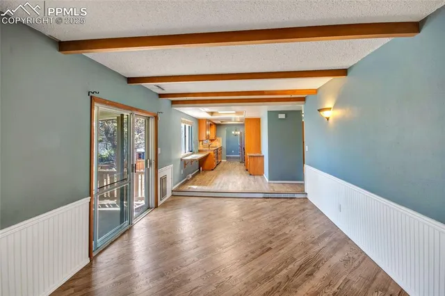 a view of entryway with wooden floor and stairs