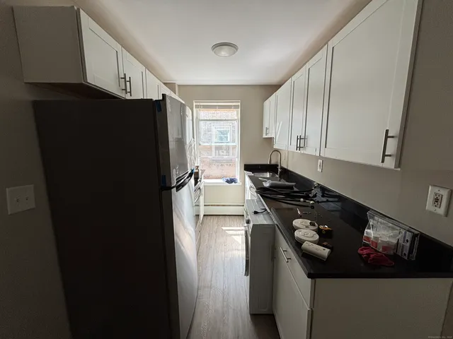 a kitchen with a appliances and cabinets