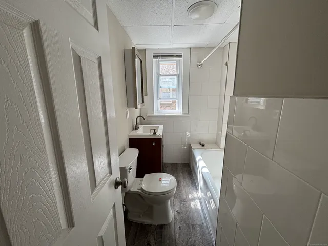 a bathroom with a toilet and a sink