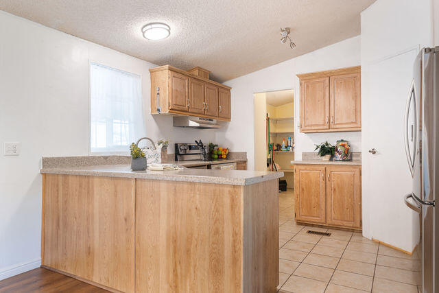 1526 North Dixie Downs Road, Unit 63 St. George, UT 84770 - Photo 11 of 38 KITCHEN VIEW TOWARDS LAUNDRY AREA