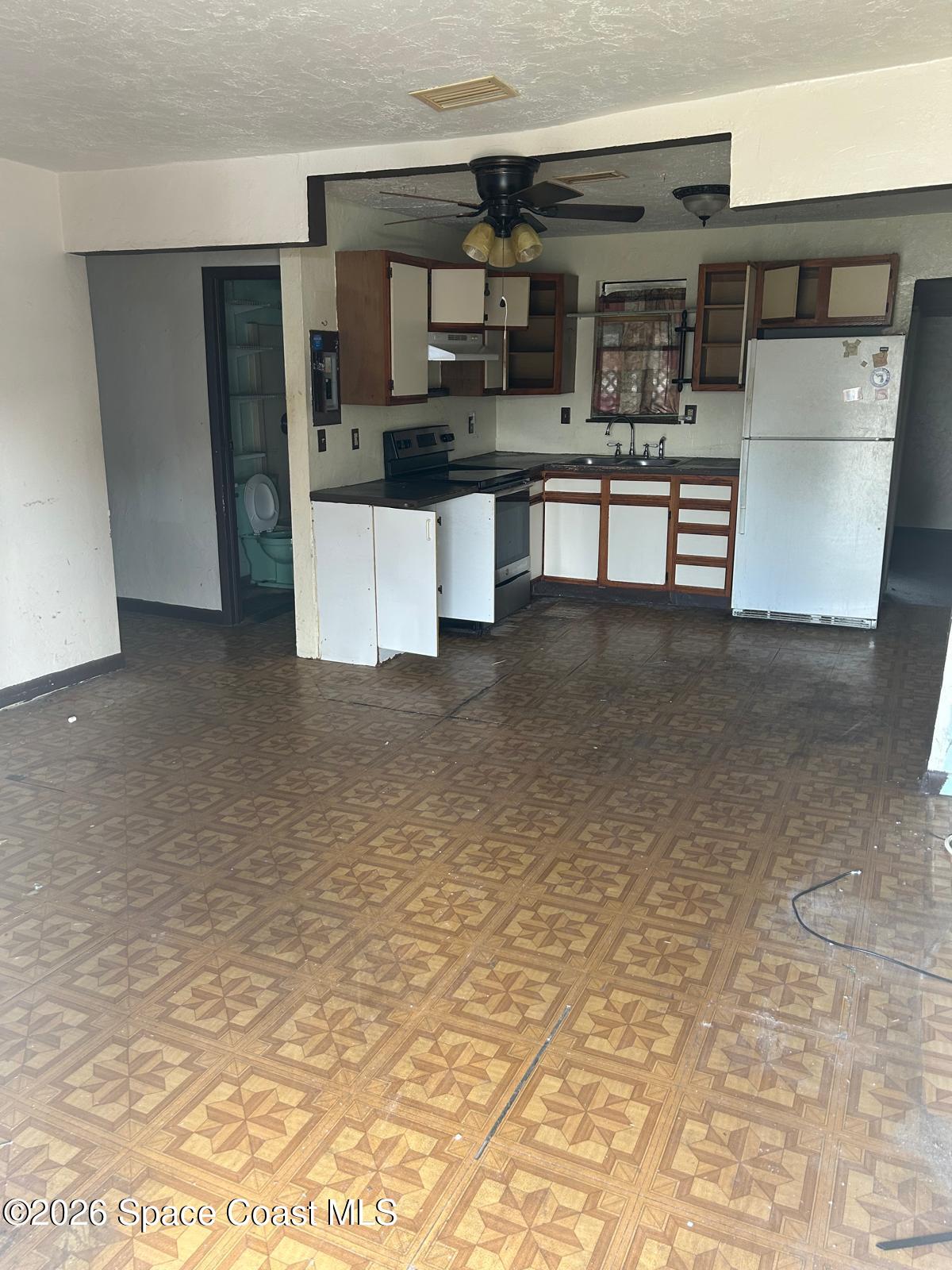 1428 Tate Street Cocoa, FL 32922 - Photo 5 of 26 a view of kitchen with stainless steel appliances cabinets