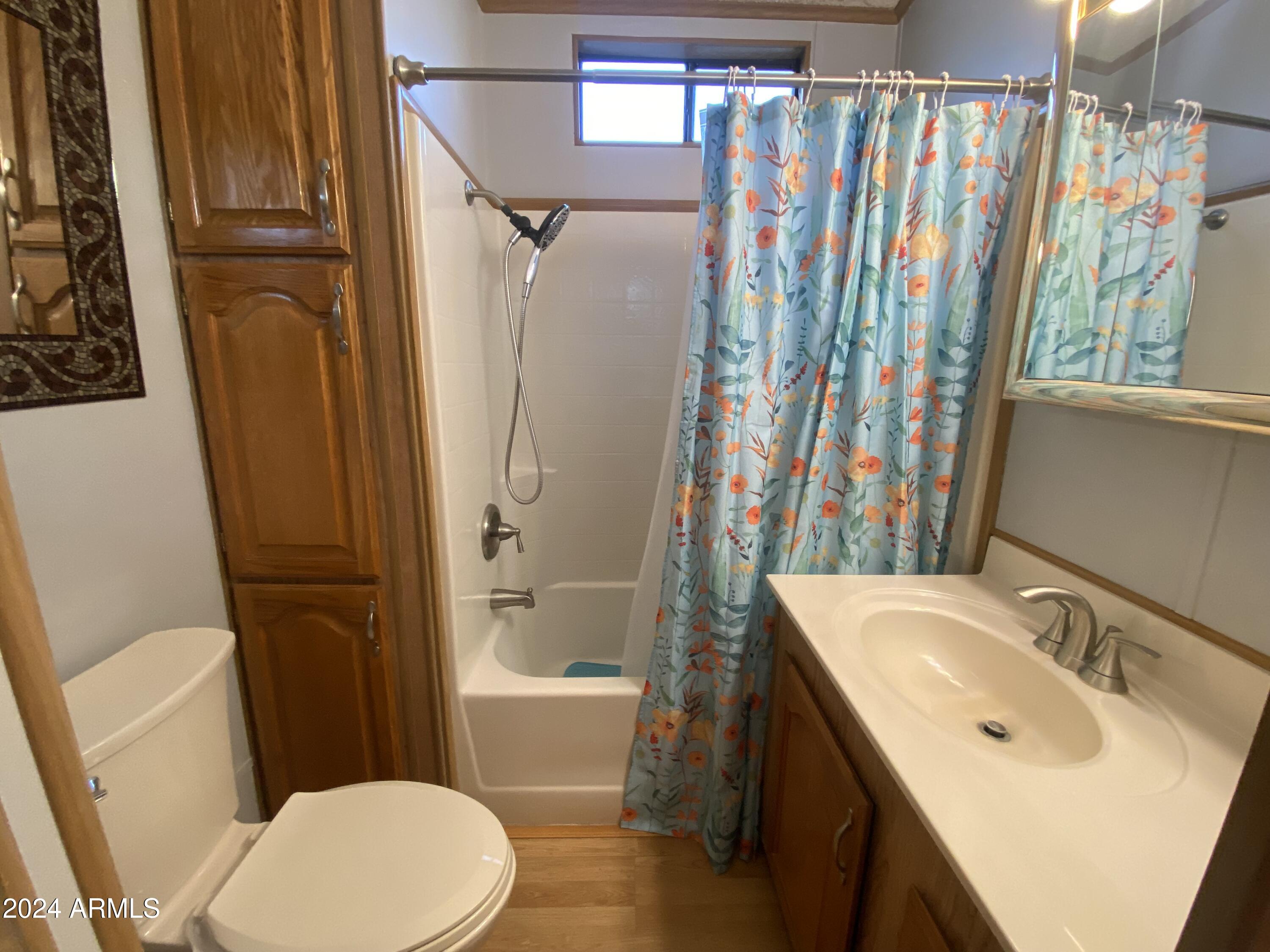 1206 West Klamath Avenue Apache Junction, AZ 85119 - Photo 22 of 35 a bathroom with a sink toilet and shower