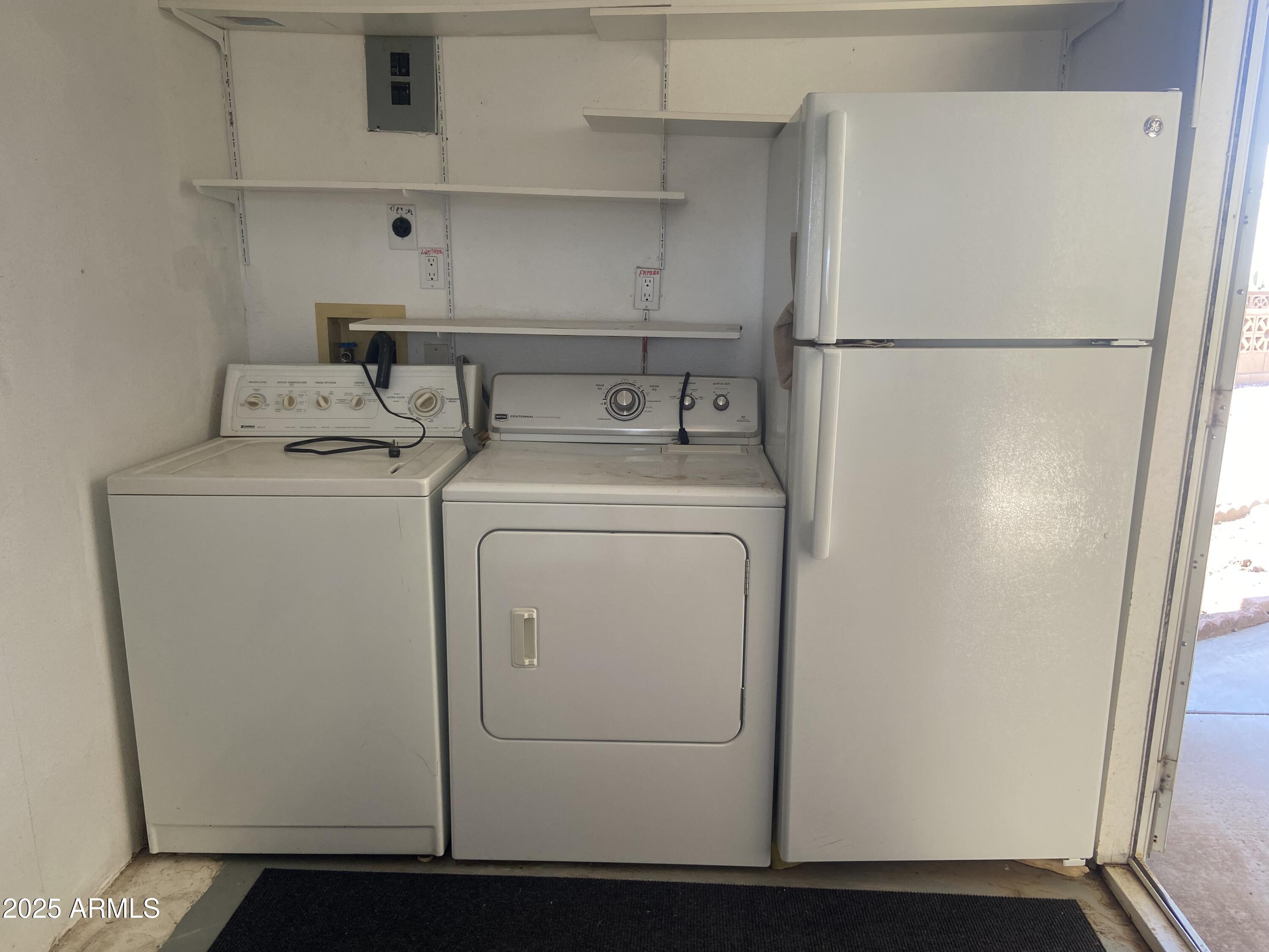 1206 West Klamath Avenue Apache Junction, AZ 85119 - Photo 26 of 35 a utility room with dryer and washer