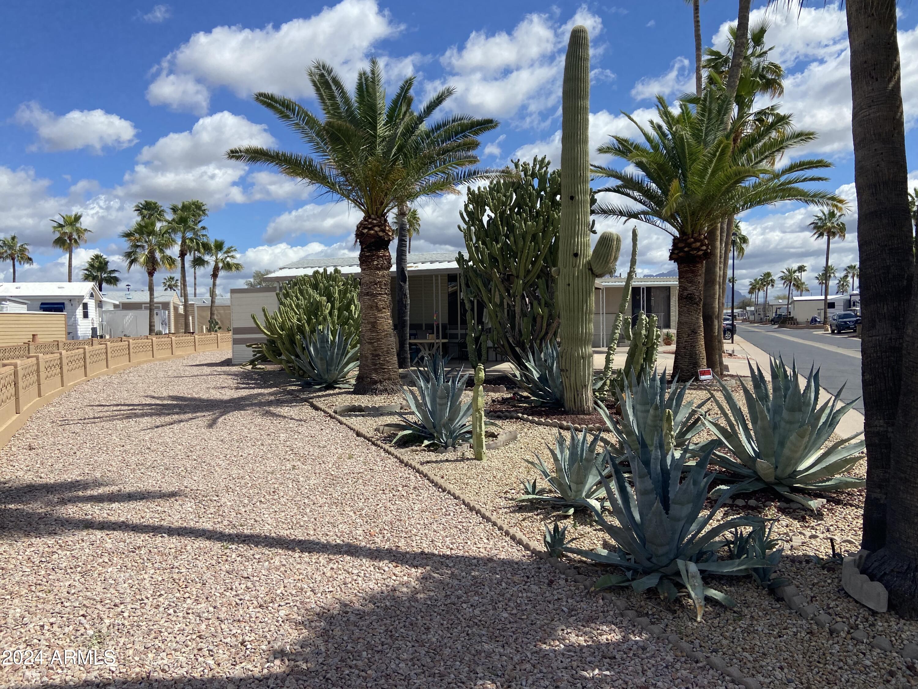 1206 West Klamath Avenue Apache Junction, AZ 85119 - Photo 30 of 35 a view of a backyard with a patio