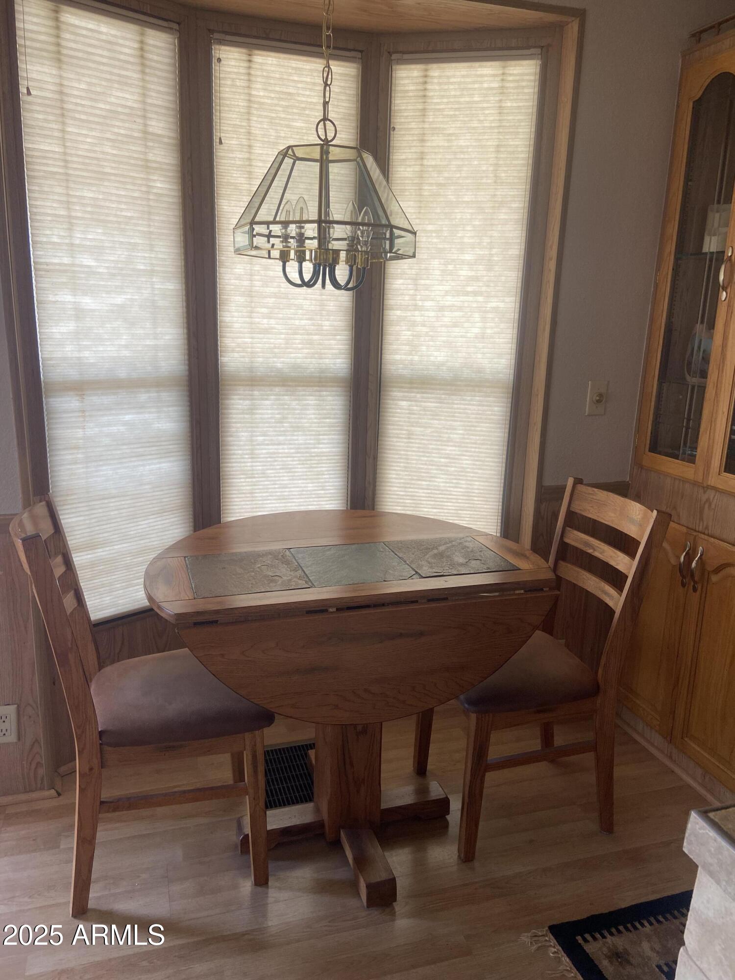 1206 West Klamath Avenue Apache Junction, AZ 85119 - Photo 9 of 35 a view of a dining room with furniture window and outside view