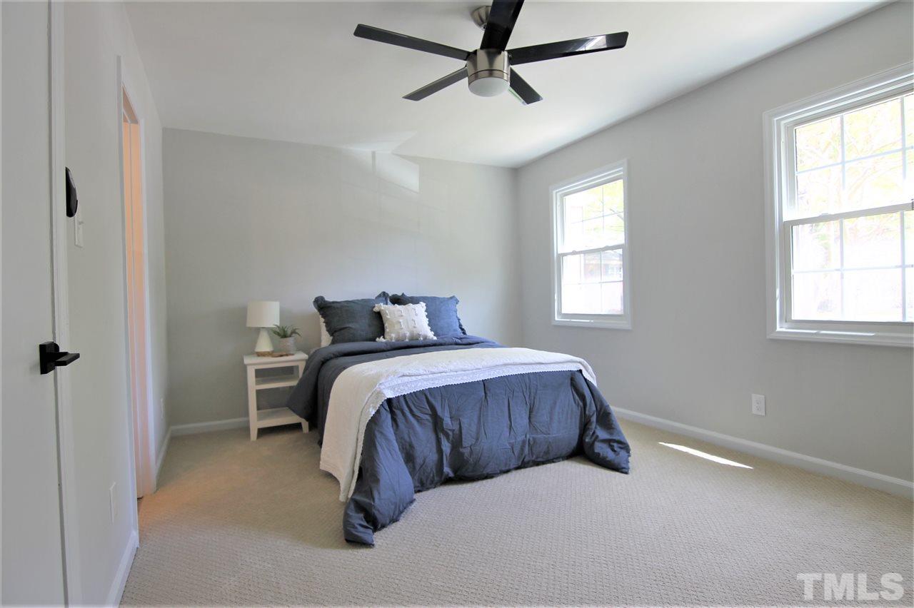 6367 New Market Way, Unit 6367 Raleigh, NC 27615 - Photo 14 of 20 a bedroom with a bed and window