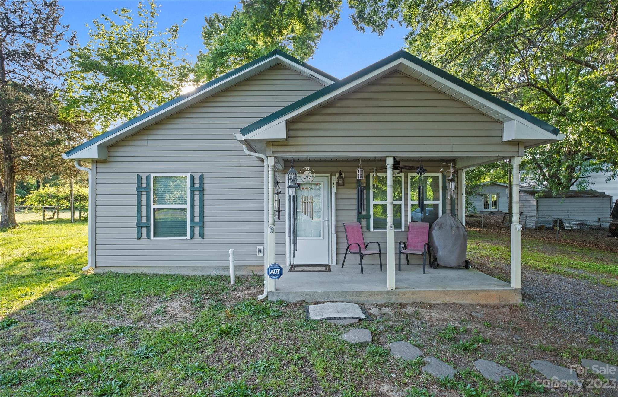 915 Harper Road Gastonia, NC 28056 - Photo 1 of 27 a view of a house with backyard porch and garden