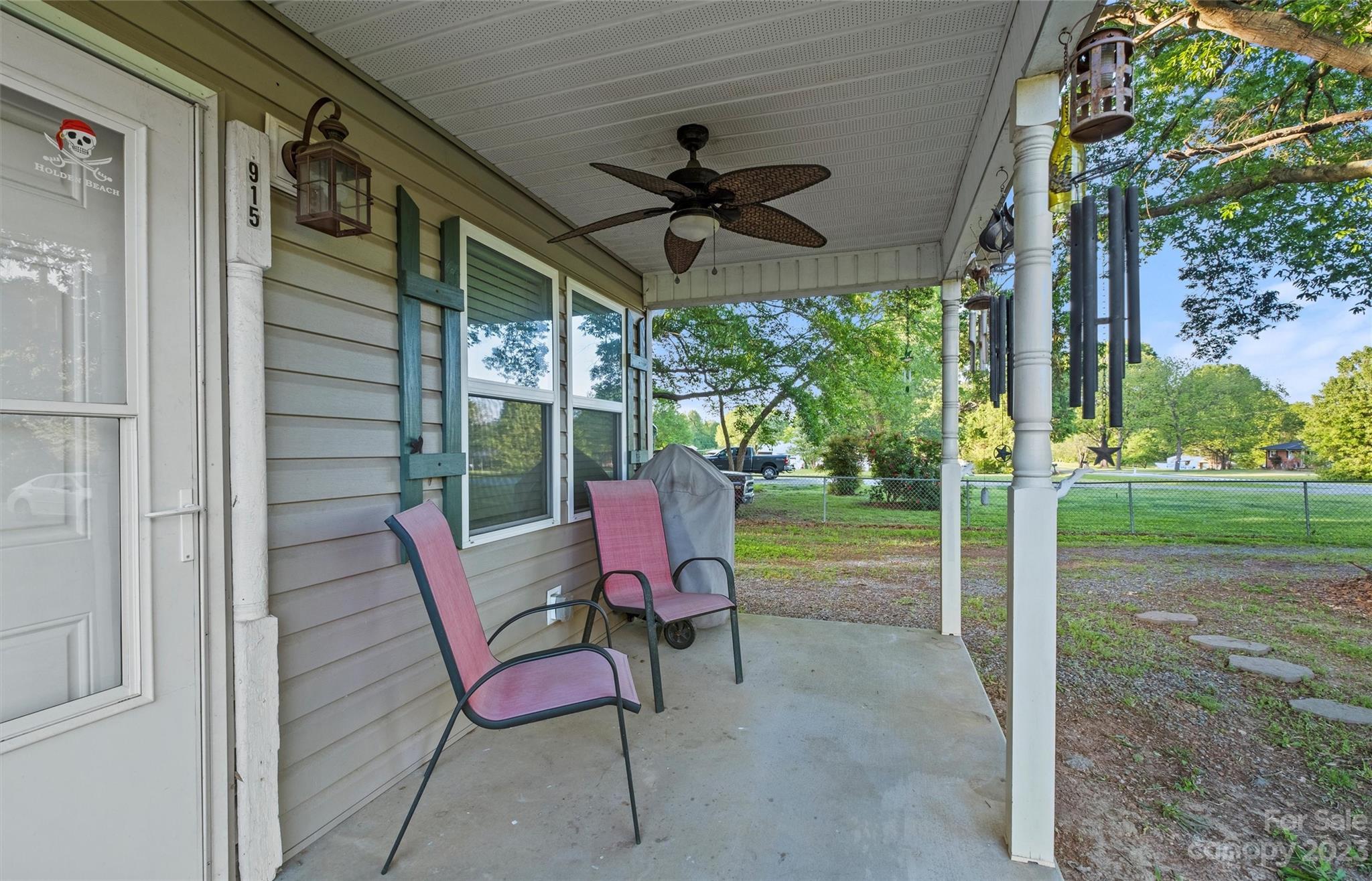 915 Harper Road Gastonia, NC 28056 - Photo 3 of 27 a view of a porch with furniture and a yard