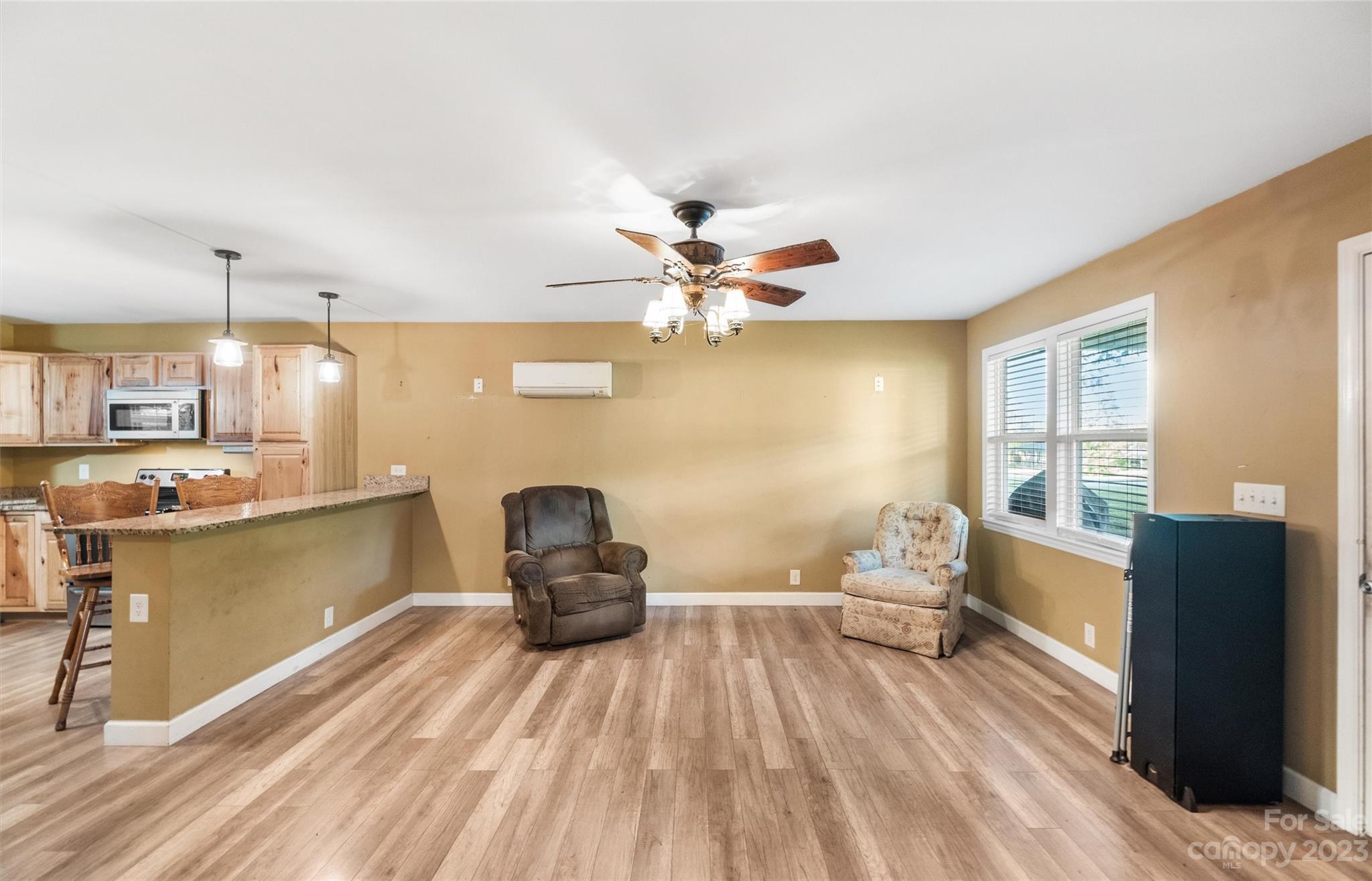 915 Harper Road Gastonia, NC 28056 - Photo 5 of 27 a living room with furniture and a wooden floor