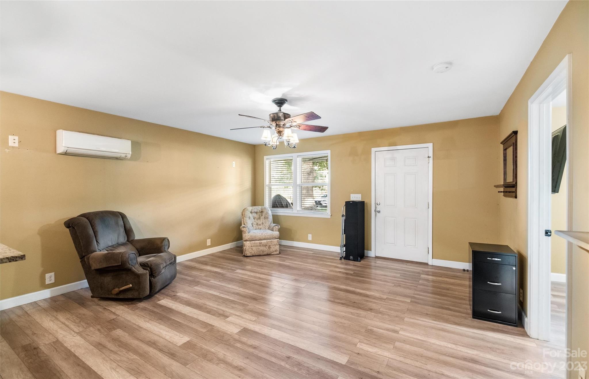 915 Harper Road Gastonia, NC 28056 - Photo 6 of 27 a living room with furniture and a chandelier