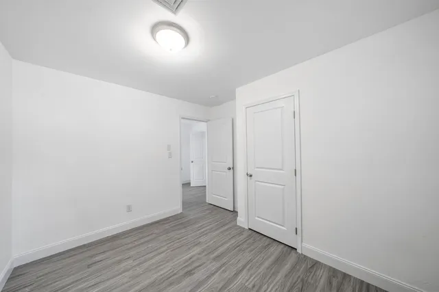 a view of room with hardwood floor