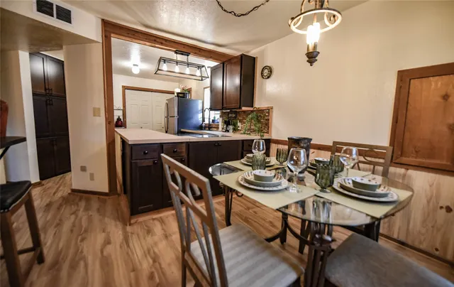 a kitchen with a table and chairs in it
