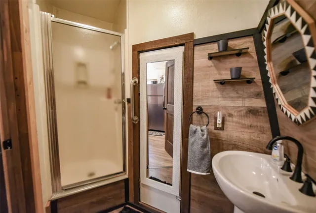 a bathroom with a sink and mirror
