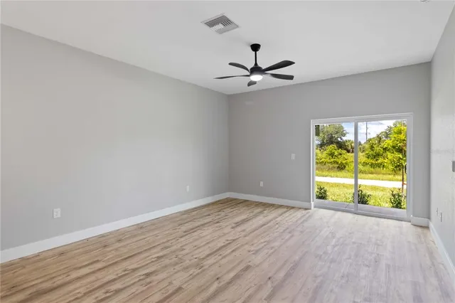a view of an empty room with a window