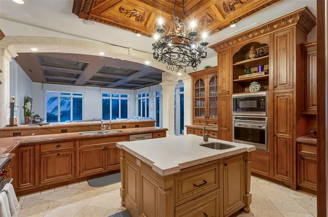 a view of a dining room with furniture and chandelier
