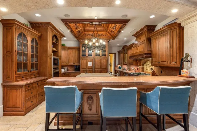 a open kitchen with stainless steel appliances granite countertop a stove a sink and a refrigerator